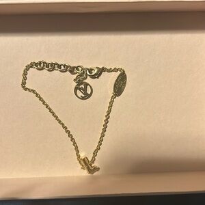 Authentic Louis Vuitton lv and me letter L bracelet . Good condition